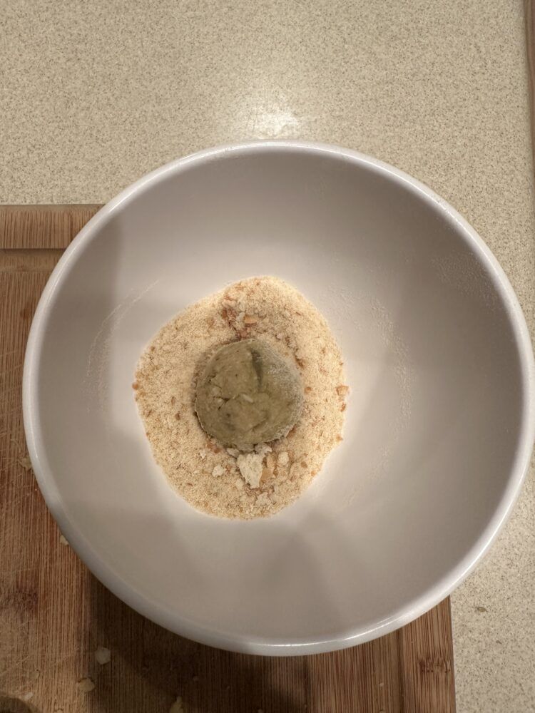 Rolling the Eggplant 'Meatballs'  in the breadcrumbs